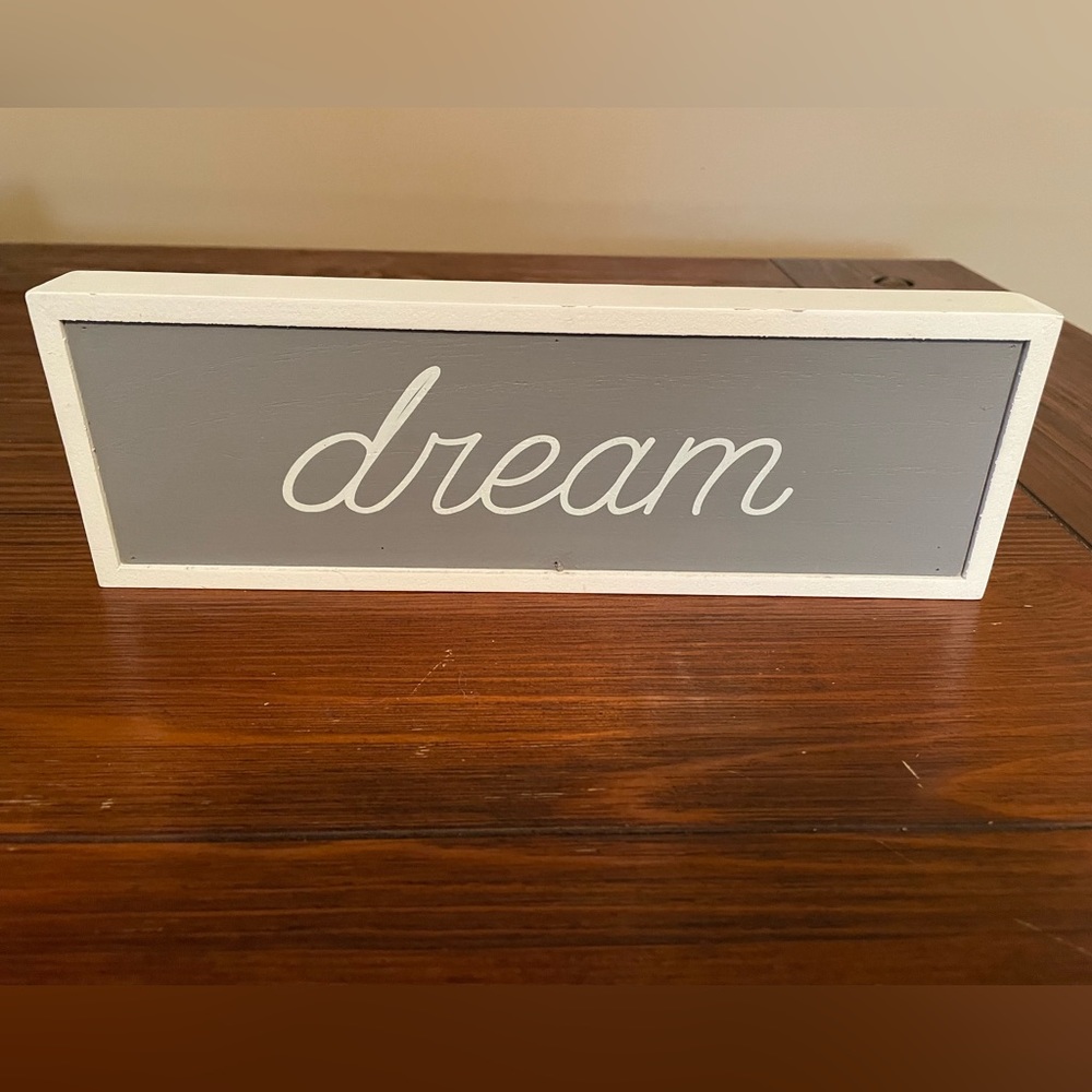 Ganz Dream hang or stand sign. White frame with gray background. Dream in white
